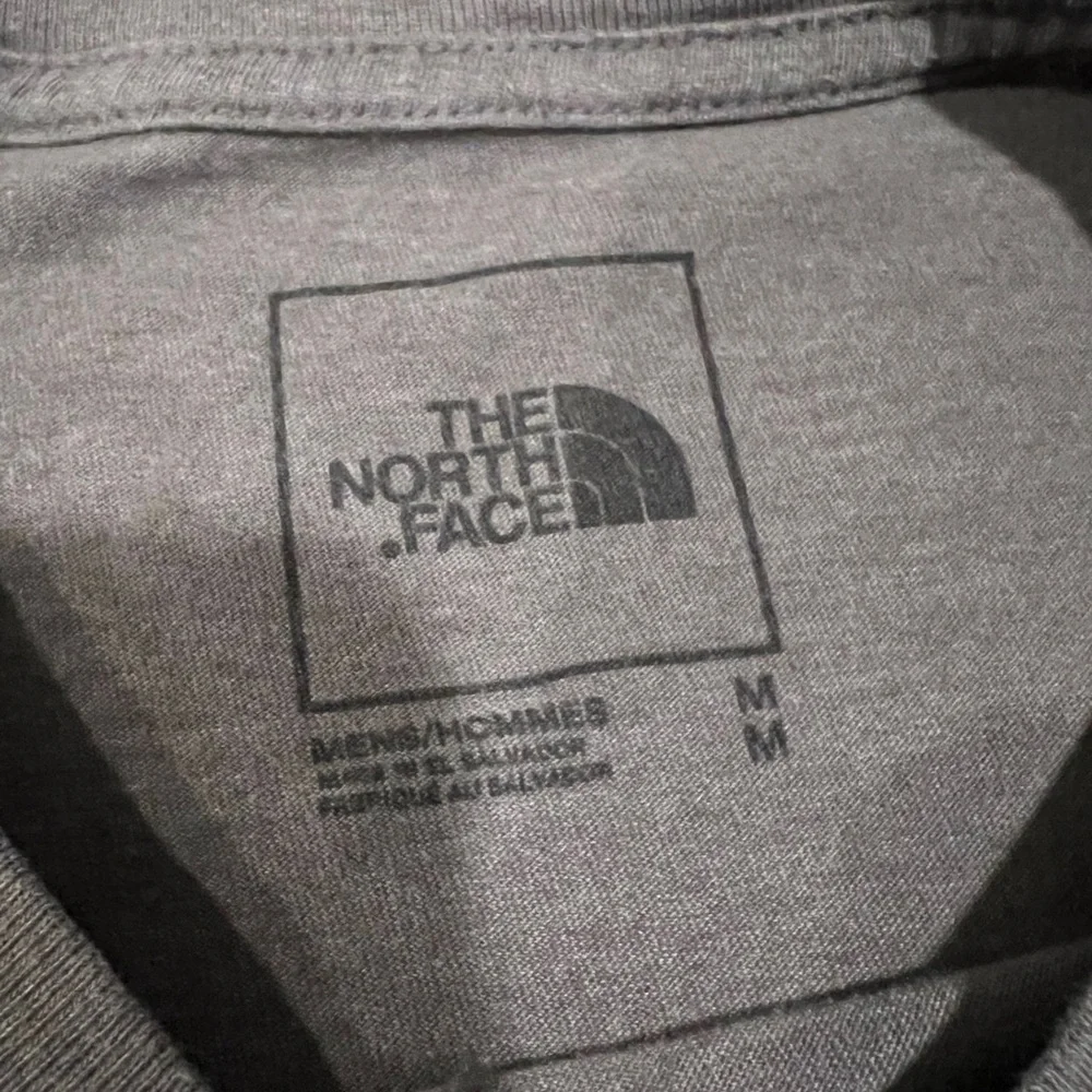 The North Face Gray Tee with Blue and Red Logo
